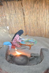 A Bedouin woman making flat bread